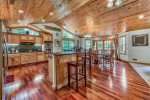 Incredible kitchen/great room with Cherry hardwood floors, and access to upper deck.